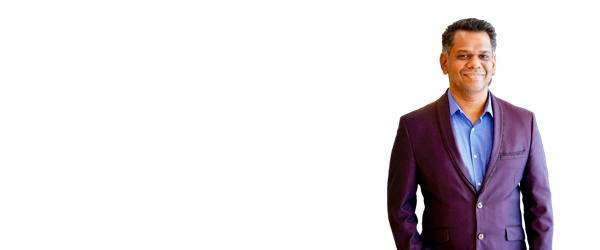 Shankar J standing, the full width of the figure preserved, on a transparent background with clear space on the left for event text, 2400 by 1000 pixels